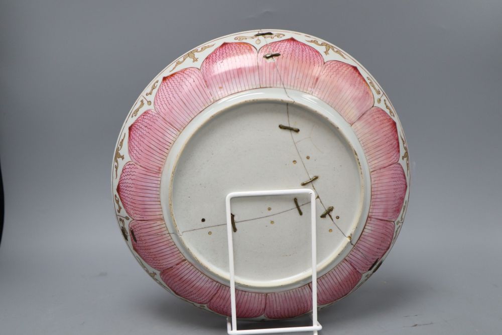 An 18th century Chinese famille rose lotus dish, d. 27cm (a.f)